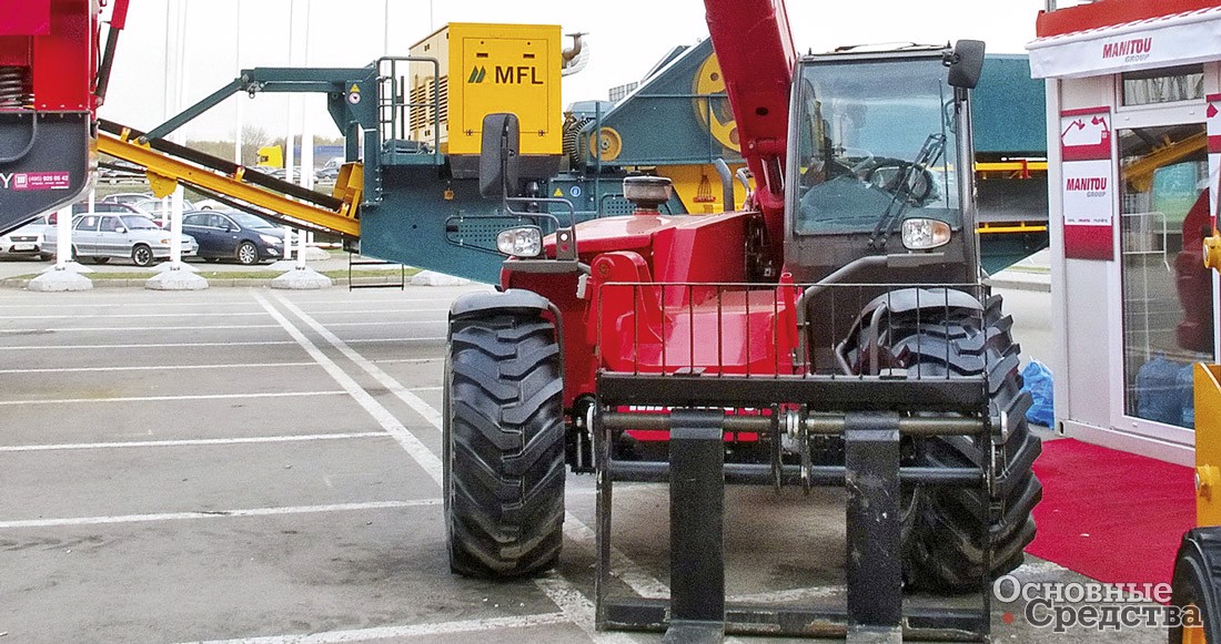 Телескопический погрузчик Manitou с захватом для  шин