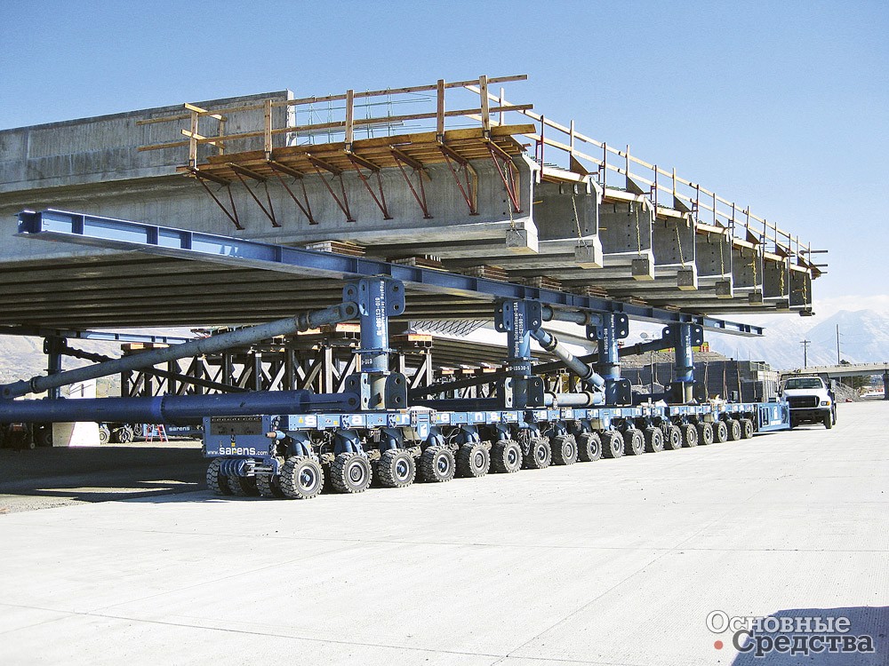 Перевозка и установка на фундаменты пролета моста с помощью самоходных модульных транспортеров типа K24 компании Kamag